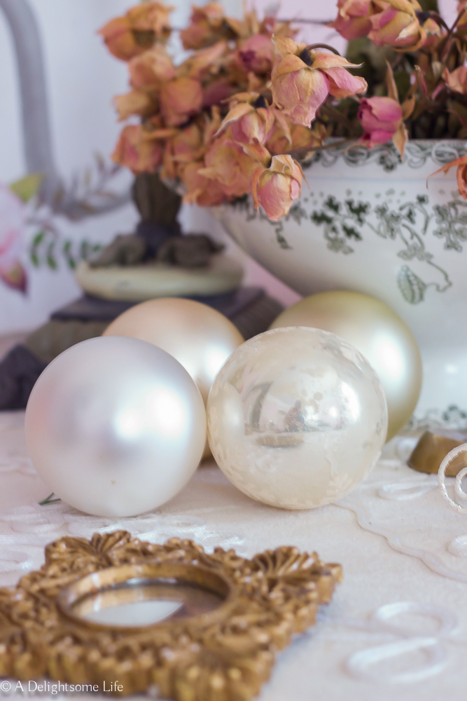 Soft romantic Christmas ball ornaments with dried roses in French inspired guest bedroom on A Delightsome Life
