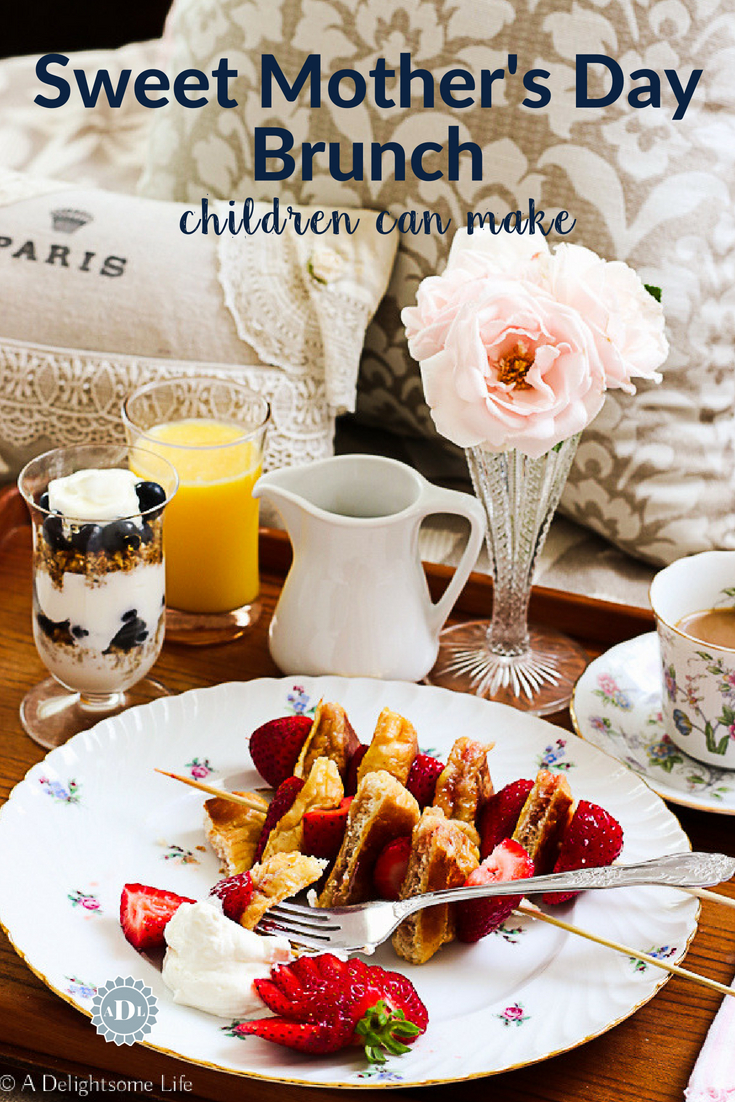 One of the most fun thing a child can do is make breakfast for Mothers on Mother's Day - here's a sweet, easy breakfast children can easily make. French toast kebab with strawberries and cream with Blueberry Granola Yogurt parfait - a sweet and delicious breakfast! #adelightsomelife #breakfast #frenchtoast #kebab #breakfastchildrencanmake #MothersDay #brunchideas #easybreakfastrecipe